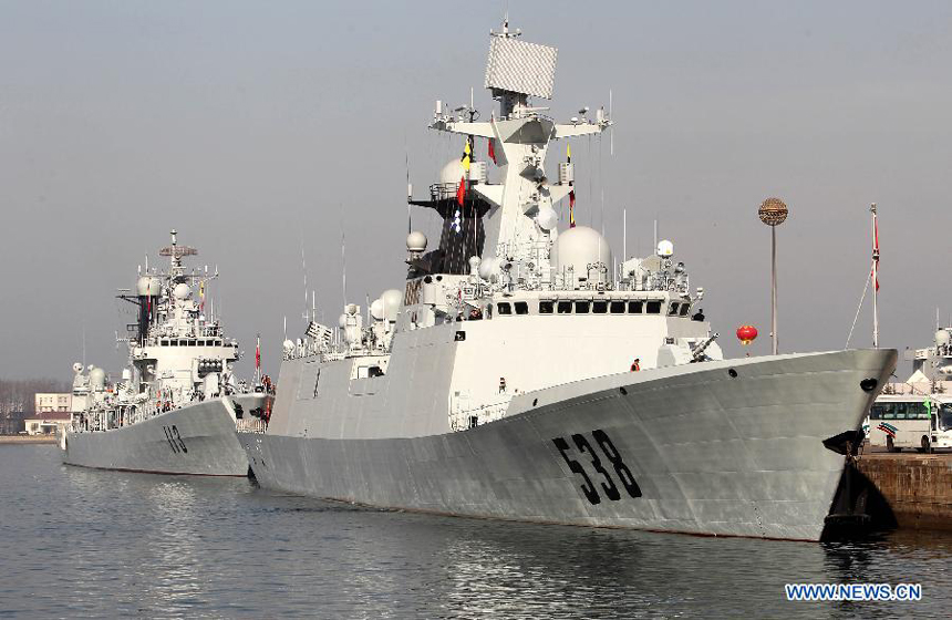 Destroyer 'Qingdao' (L) and frigate 'Yantai' prepare to set sail at a port in Qingdao, east China's Shandong Province, Feb. 27, 2012. The 11th Chinese naval escort flotilla, consisting of destroyer 'Qingdao', frigate 'Yantai' and comprehensive supply ship 'Huishanhu', departed from Qingdao on Monday for the escort mission in the Gulf of Aden and Somali waters to protect commercial ships from pirate attacks.