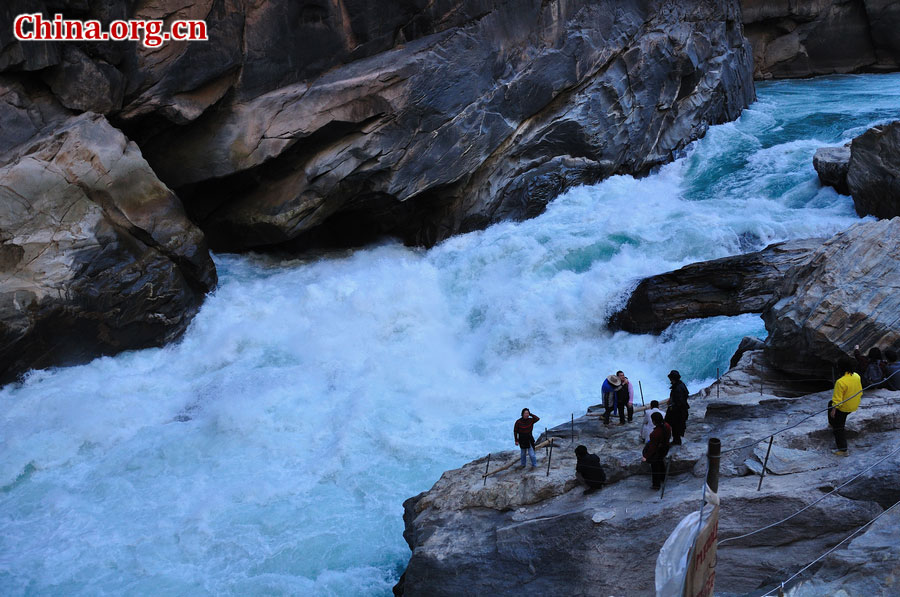 Hutiao Gorge is located on the upper reaches of the Jinsha River, to the northeast of Lijiang, in southwest China's Yunnan Province. The narrowest stretch in the river is only about 30 meters across and carries the legend that a tiger could easily jump across the river. The river is about 29 km long, reaching 3,790 meters in depth between Jade Dragon and Haba Snow Mountains, creating one of the most spectacularly deep gorges in the world. [China.org.cn]