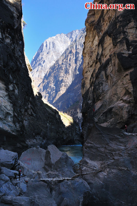 Hutiao Gorge is located on the upper reaches of the Jinsha River, to the northeast of Lijiang, in southwest China's Yunnan Province. The narrowest stretch in the river is only about 30 meters across and carries the legend that a tiger could easily jump across the river. The river is about 29 km long, reaching 3,790 meters in depth between Jade Dragon and Haba Snow Mountains, creating one of the most spectacularly deep gorges in the world. [China.org.cn]