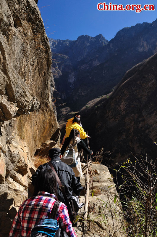 Hutiao Gorge is located on the upper reaches of the Jinsha River, to the northeast of Lijiang, in southwest China's Yunnan Province. The narrowest stretch in the river is only about 30 meters across and carries the legend that a tiger could easily jump across the river. The river is about 29 km long, reaching 3,790 meters in depth between Jade Dragon and Haba Snow Mountains, creating one of the most spectacularly deep gorges in the world. [China.org.cn]