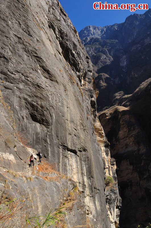 Hutiao Gorge is located on the upper reaches of the Jinsha River, to the northeast of Lijiang, in southwest China's Yunnan Province. The narrowest stretch in the river is only about 30 meters across and carries the legend that a tiger could easily jump across the river. The river is about 29 km long, reaching 3,790 meters in depth between Jade Dragon and Haba Snow Mountains, creating one of the most spectacularly deep gorges in the world. [China.org.cn]