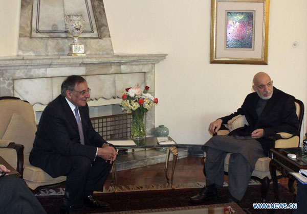 Afghanistan's President Hamid Karzai (R) meets with visiting U.S. Defense Secretary Leon Panetta in Kabul, capital of Afghanistan, on March 15, 2012. Panetta paid an unannounced visit to Afghanistan on Wednesday and visited southern Helmand province, an official said. [Xinhua/POOL]