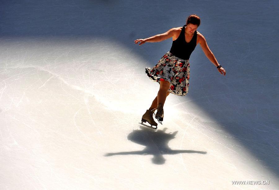 A woman enjoys skating on a public ice rink at the Rockfeller Center in Manhattan of New York City, March 19, 2012. (Xinhua/Wang Lei) 