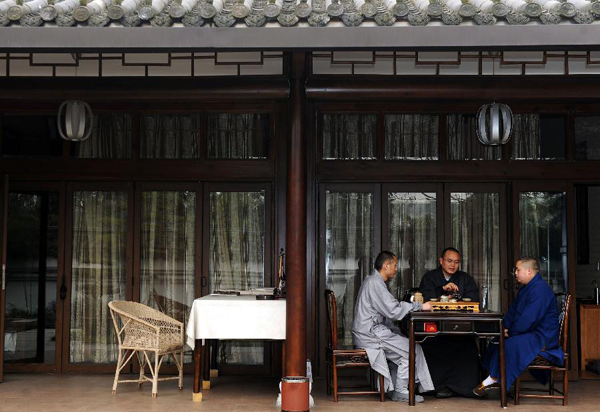 Masters of the Buddhist Academy of Emei Mountain rest during an interval of classes in Emei Mountain, southwest China's Sichuan province, March 16, 2012. Established in 1927, the school, covering an area of more than 10,000 square meters presently, has courses mainly on Buddhism studying. [Photo/Xinhua] 