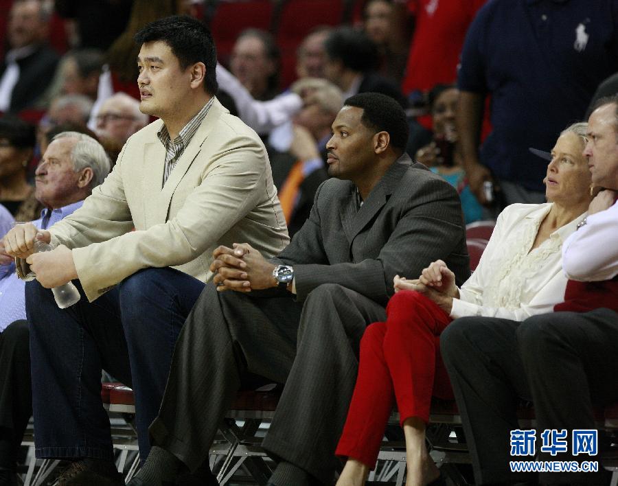 Former Houston Rockets center Yao Ming watches the Rockets play the Los Angeles Lakers in an NBA basketball game Tuesday, March 20, 2012, in Houston.