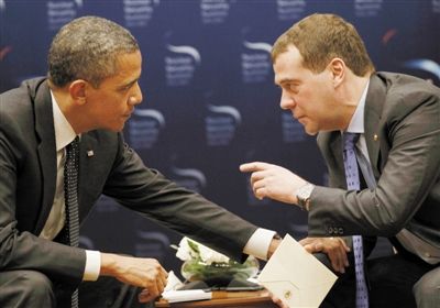 TV cameras have recorded US President Barack Obama having an unguarded conversation with Russian President Dmitry Medvedev.