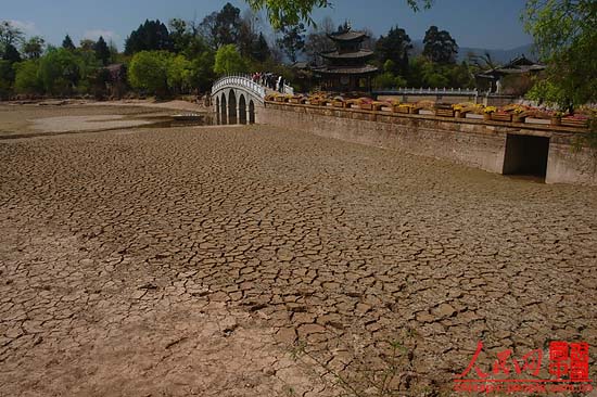 Heilong pond, a symbol of Lijiang, China’s famous tour destination, is dried-up due to the severe drought in Yunan province in recent years. The badly cracked lakebed of Heilong pond destroys the local scenery.