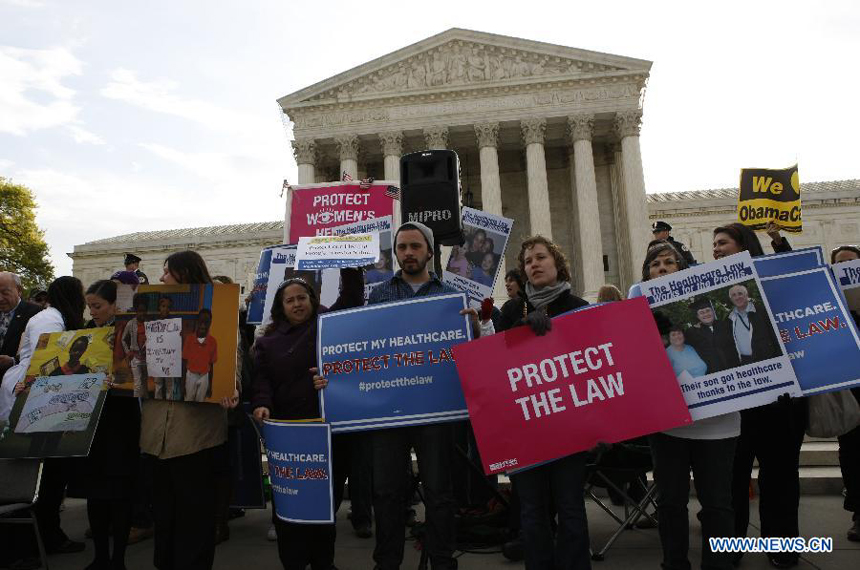 Protestors gather outside Supreme Court building during the protest of Healthcare hearing in Washington D.C., capital of the United States, on March 28, 2012. The U.S. Supreme Court on Wednesday entered its last day of oral arguments in the landmark case involving the Affordable Care Act, the signature healthcare overhaul of President Barack Obama.