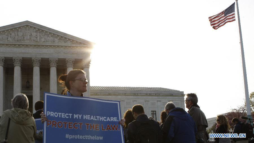 Protestors gather outside Supreme Court building during the protest of Healthcare hearing in Washington D.C., capital of the United States, on March 28, 2012. The U.S. Supreme Court on Wednesday entered its last day of oral arguments in the landmark case involving the Affordable Care Act, the signature healthcare overhaul of President Barack Obama. 