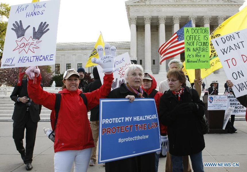 Protestors gather outside Supreme Court building during the protest of Healthcare hearing in Washington D.C., capital of the United States, on March 28, 2012. The U.S. Supreme Court on Wednesday entered its last day of oral arguments in the landmark case involving the Affordable Care Act, the signature healthcare overhaul of President Barack Obama.