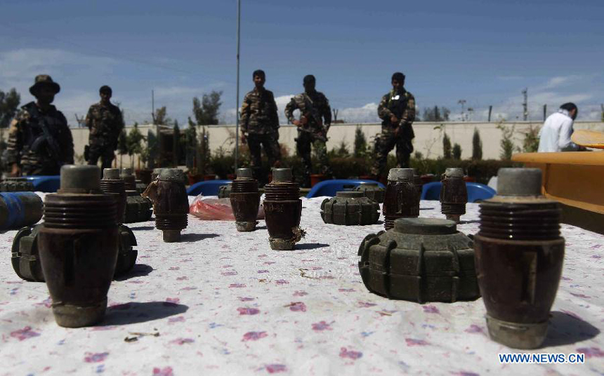 Afghan security forces display Taliban ammunition after being captured by the Afghan national security forces in Laghman Province, east of Kabul, capital of Afghanistan on March 28, 2012. Seven male Taliban fighters wearing female clothes captured by Afghan security forces during their operations in Laghman Province, official said. 