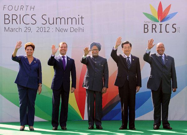 President Hu Jintao joins other leaders of the BRICS group for photos at the start of their summit in New Delhi, India, on Thursday. [Xinhua]