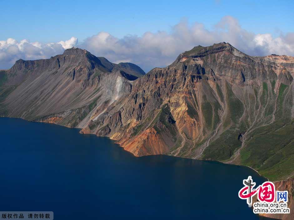 Changbai Mountain in southeastern Jilin Province is located on the border between China and North Korea. Considered as the most famous mountain in northeast China, Changbai Mountain has rich biodiversity. With an average altitude of 2,000 meters, the mountain is well-known for its snowy scenery, cool summers and an abundance of mineral springs.[China.org.cn] 