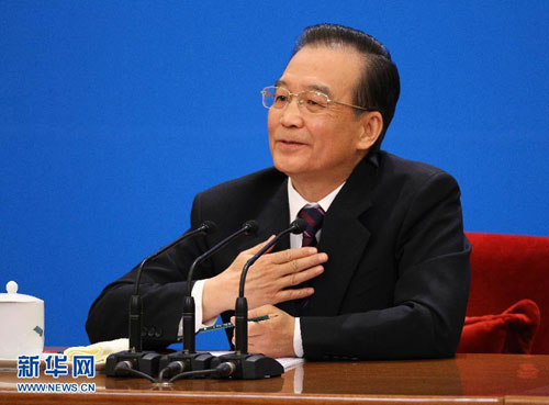 Chinese Premier Wen Jiabao meets the press after the closing meeting of the Fifth Session of the 11th National People's Congress (NPC) at the Great Hall of the People in Beijing, March 14, 2012. [Xinhua photo]