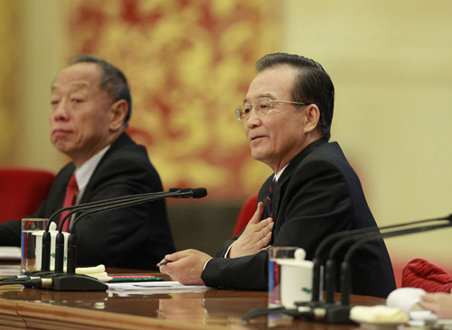 Chinese Premier Wen Jiabao meets the press after the closing meeting of the Fifth Session of the 11th National People's Congress (NPC) at the Great Hall of the People in Beijing, March 14, 2012.