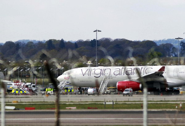 A Virgin aircraft is seen on the ground after making an emergency landing at Gatwick Airport in southern England April 16, 2012. [Photo/Agencies]