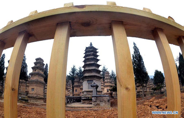 Photo taken on March 15, 2012 shows the fences built to protect the Buddhist pagodas in the famous Shaolin Temple in Dengfeng city, central China's Henan province.[Photo/Xinhua] 