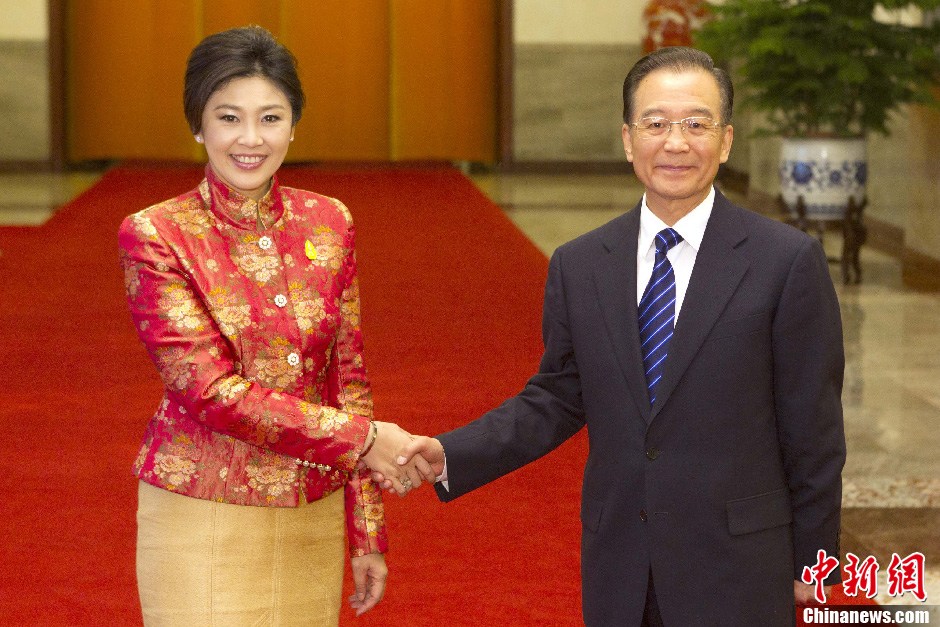 Premier Wen Jiabao shakes hands with Thai Prime Minister Yingluck Shinawatra in Beijing on Tuesday. 