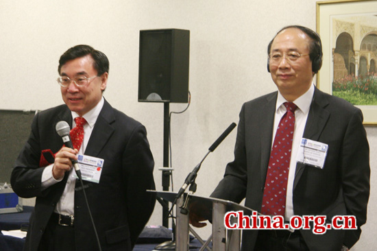 Zhao Qizheng (R), interacts with guests at his book launch on April 17, 2012.