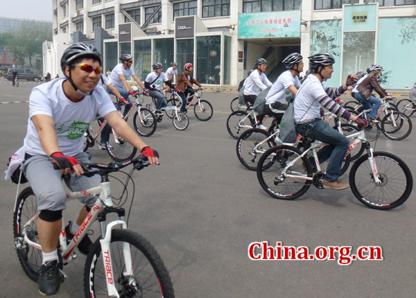 About 120 participants go on a bike ride, called the 'Climate Race', to celebrate the 43rd International Earth Day. 