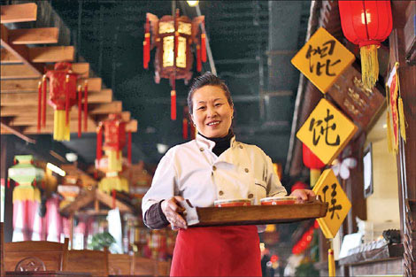 Hou Shuming runs a booth at Wan Feng Snacks. Photos by Wang Jing / China Daily