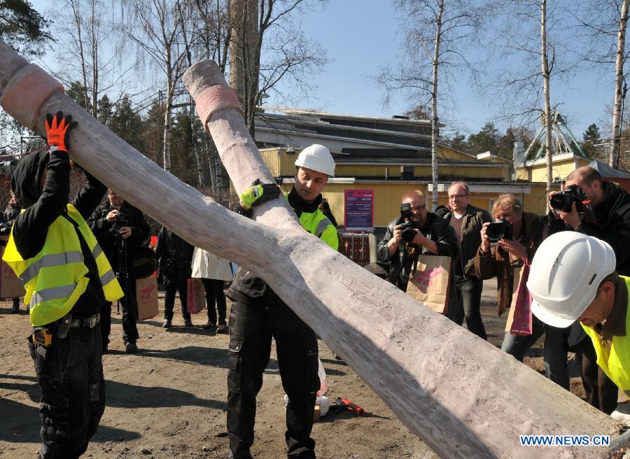 Workers install a giant slingshot which is a part of the 'Angry Birds' game at the Angry Birds Land built in Sarkanniemi Adventure Park, Tampere, Finland, April 25, 2012. 