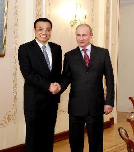 Chinese Vice Premier Li Keqiang meets with Russian Prime Minister and President-elect Vladimir Putin. [Xinhua] 