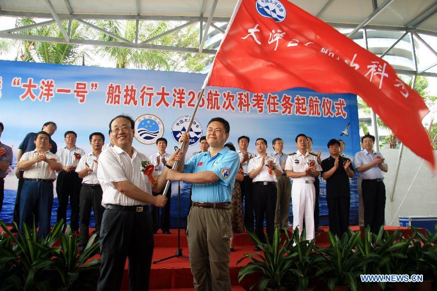 Tao Chunhui (R, front), chief scientist of the expedition team of Chinese scientific research ship Dayang Yihao (Ocean No.1), attends the ceremony for the 26th expedition of the ship in Sanya, south China's Hainan Province, April 28, 2012. The Chinese research vessel Dayang Yihao departed from the city of Sanya on Saturday, kicking off the country's 26th oceanic expedition mission. 