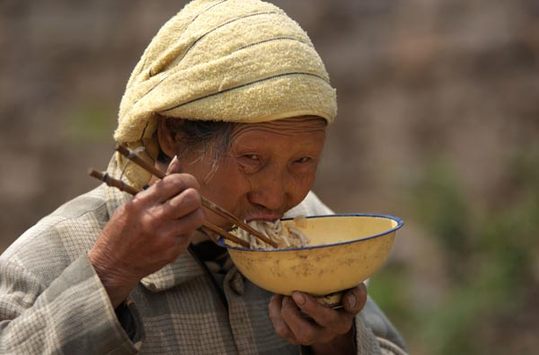 Hou Zhangying, a 73-year-old woman in the village, has been diagnosed with tuberculosis. [China Daily]