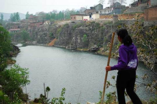 The Qihe River is the sole source of drinking water for Dangjie village, in Linzhou, Henan province. Villagers said the river has been polluted in recent years by businesses upstream. [China Daily] 