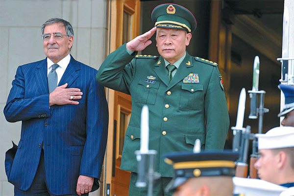 US Defense Secretary Leon Panetta and Defense Minister Liang Guanglie attend a welcoming ceremony at the Pentagon on Monday. It is the first visit by a defense minister to the US since 2003. [Wu Qingcai/China News Service] 