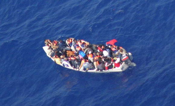 An aerial photo from the past shows an overcrowded boat off the coast of Malta. [ANSA]