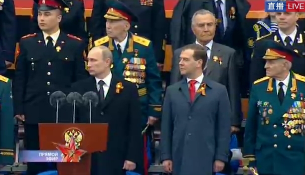 Russian President Vladimir Putin and Prime Minister Dmitry Medvedev observe the Victory Day parade.