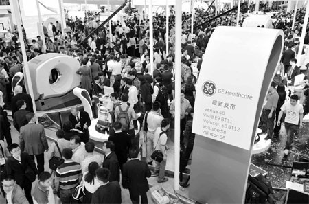 A GE Healthcare booth at a trade show in Shenzhen, Guangdong province. John Rice, vice-chairman of GE and president of Global Growth and Operations, predicted the company's China business will grow by more than 15 percent this year, with each segment expanding at two to three times the GDP growth rate.[China Daily]