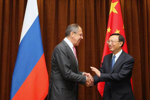 Foreign Minister Yang Jiechi meets his Russian counterpart Sergei Lavrov on Thursday. Lavrov is in Beijing to attend a meeting of foreign ministers of the Shanghai Cooperation Organization. [Jiang Dong/China Daily]