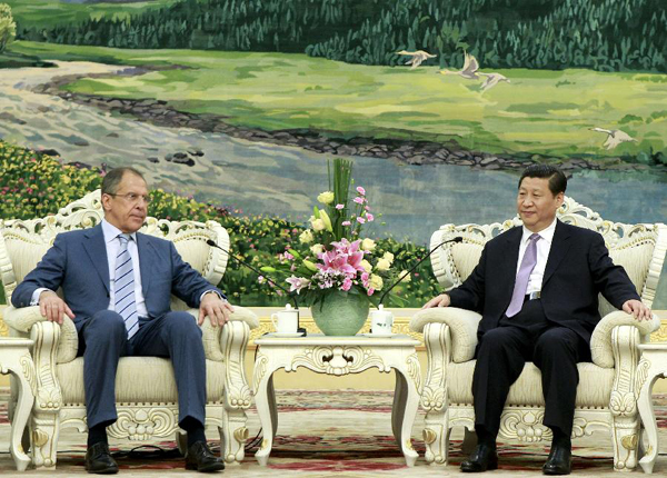 China vows to ensure successful meeting between Hu, Putin