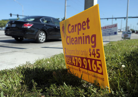 Cheap signs scattered on lawns and along the corners of busy intersections are hard to miss. [Agencies]