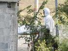 Forensic technicians remove a body from a crime scene in the municipality of Cadereyta May 13, 2012.