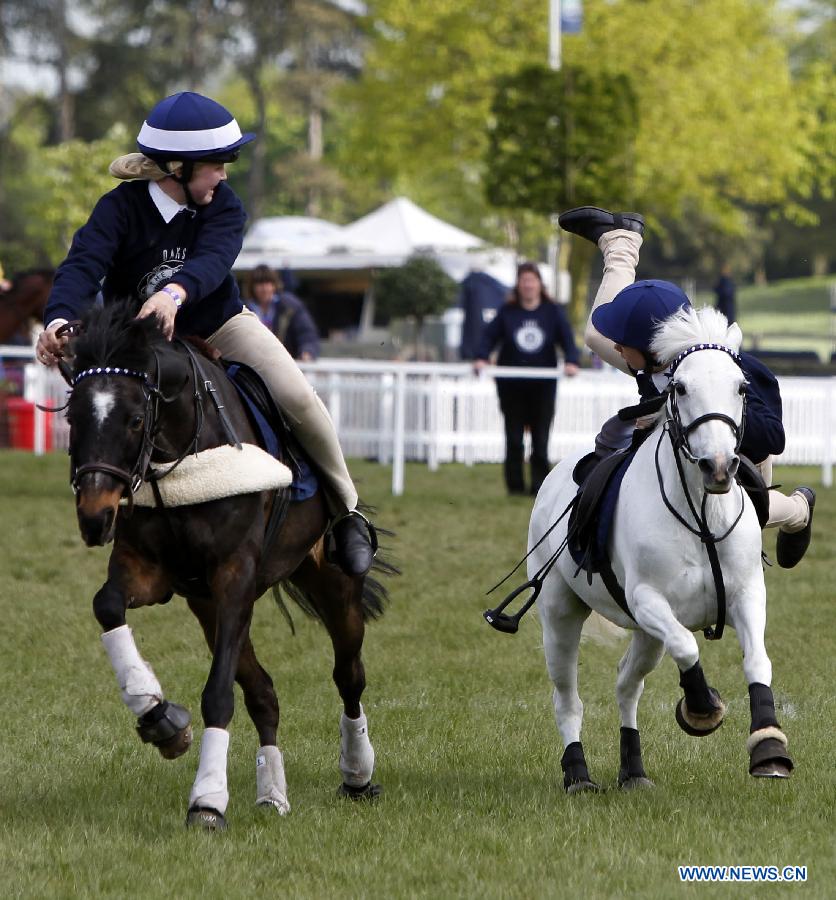 Riders of team Scotland take part in the pony competition of Windsor Horse Show in Windsor, Britain on May 12, 2012. (Xinhua/Wang Lili)