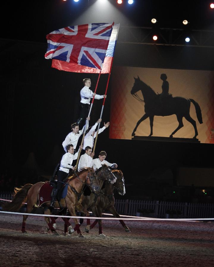 Russian riders perform during the diamond jubilee pageant of Windsor Horse Show in Windsor, Britain on May 12, 2012. (Xinhua/Wang Lili) 
