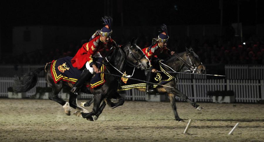 Pakistan riders perform during the diamond jubilee pageant of Windsor Horse Show in Windsor, Britain on May 12, 2012. (Xinhua/Wang Lili) 