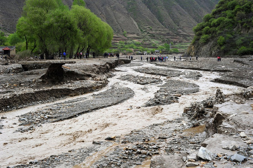 Authorities in northwest China have reported 53 deaths and 18 people missing as of 4 p.m. Monday as a result of hail and torrential rains that battered two mountainous counties in the region last week. [Xinhua photo]