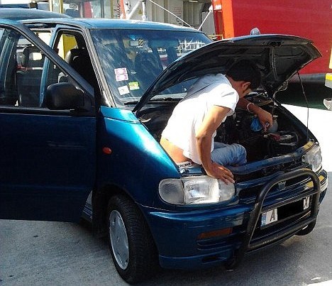 The man emerges from the car having spent 20 hours hidden. [Agencies]