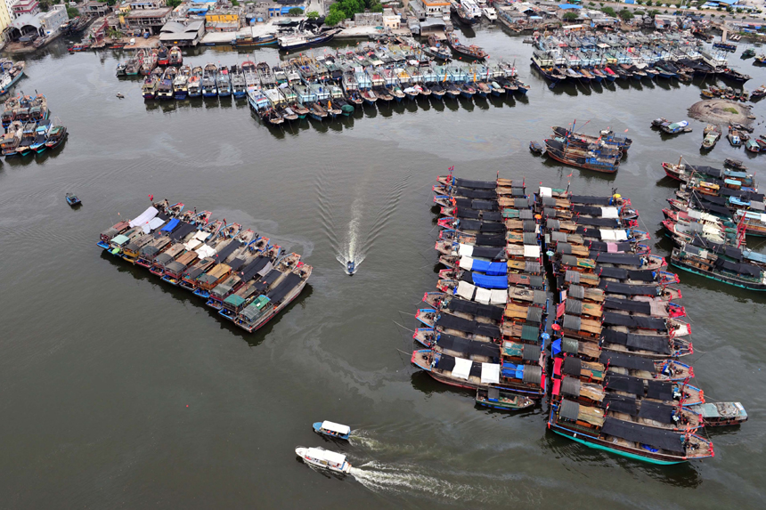 Vessels anchor in Sanya, Hainan Province, May 16, 2012.