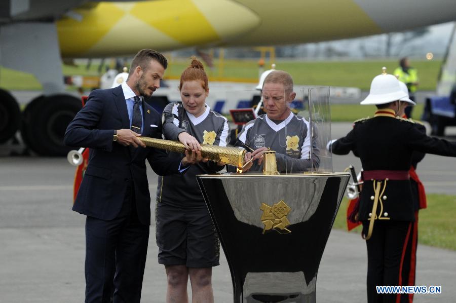 Beckham kicks off torch relay on British soil