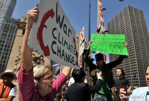 Protestors participate in a rally in Chicago, the United States, on May 18, 2012. Over 2,000 people rallied in downtown Chicago Friday to protest against the policies of G8 and NATO. 