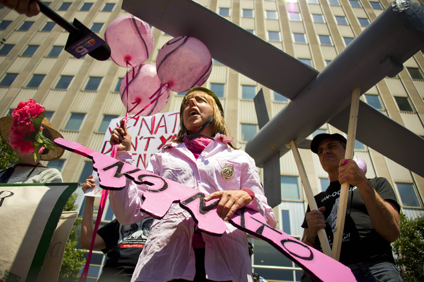 Demonstrators with Code Pink protest out Chicago Obama Headquarters in Chicago, Illinois, May 17, 2012, as peace activists march through the street demanding an end to NATO violence ahead of the NATO 2012 Summit. 