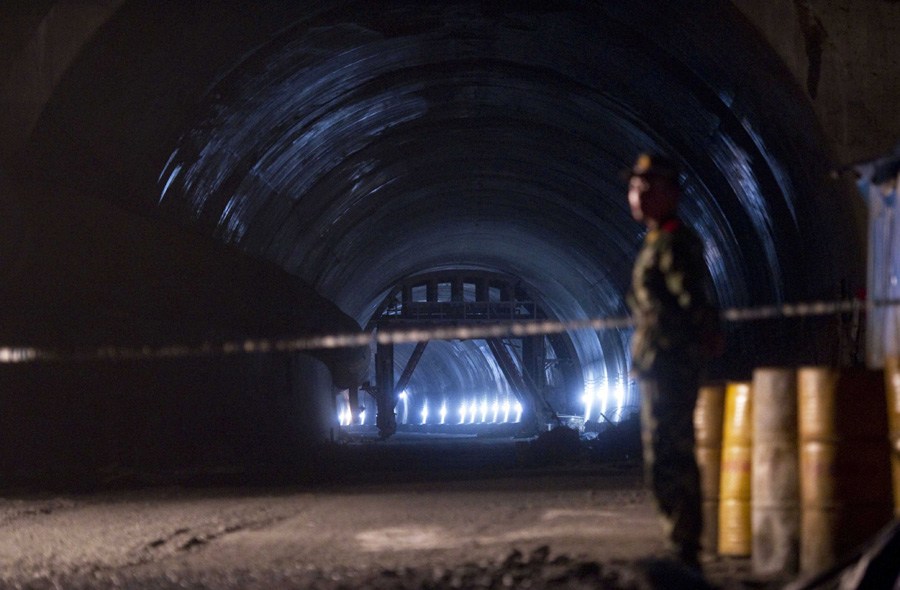 The entrance of the tunnel where a deadly explosion took place is cordoned off, in Yanling, central China's Hunan Province, May 20, 2012. Twenty people were killed in an explosion when a vehicle carrying explosives was unloading inside the under-construction expressway tunnel in Hunan Saturday morning. 