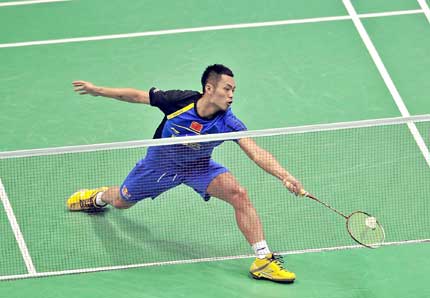 China's Lin Dan in action against Rajiv Ouseph of England during their Thomas Cup group match in Wuhan, central China's Hubei Province, yesterday. Lin won 2-0 as the host began with a 5-0 triumph in the team event. The Chinese women beat South Africa 5-0 in the Uber Cup.  