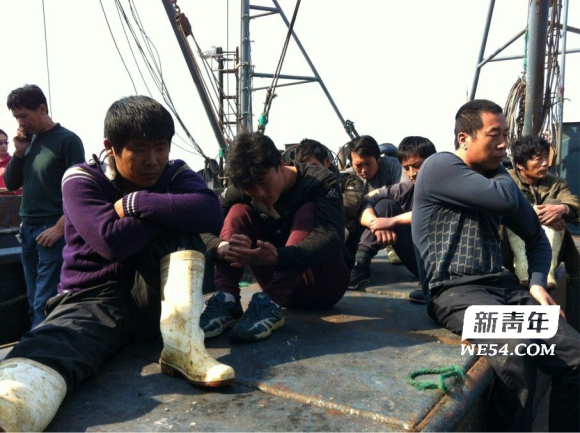 Three Chinese fishing boats and 29 Chinese fishermen detained by the DPRK hijackers arrive at the Dalian port following their release, May 21, 2012. 